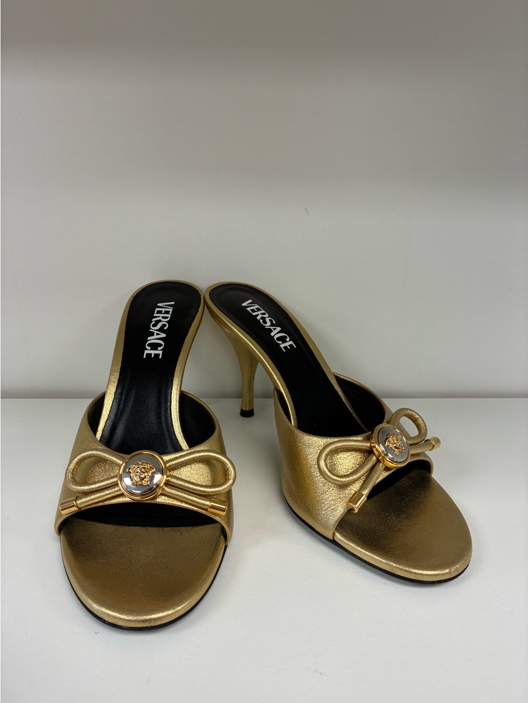 Versace Metallic Gold Open-Toe Slide Heels With Bow Accent